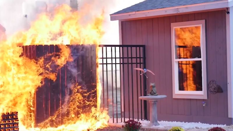 The concern is an attached combustible fence, not every wood fence