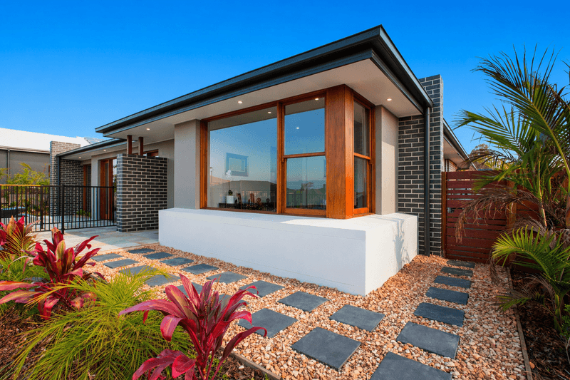 Replace combustible mulch with a maintained noncombustible surface