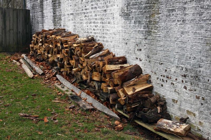 Stacking Firewood Right Next to the House