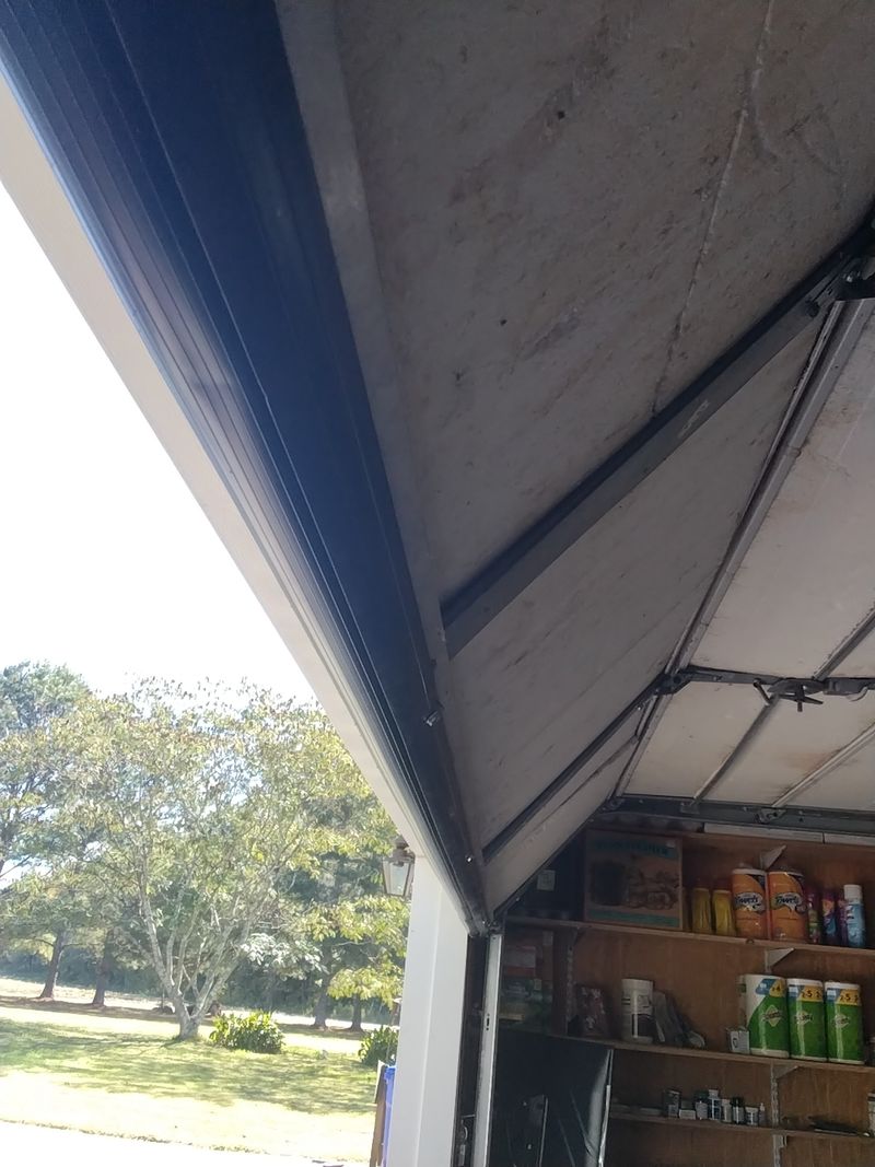 Around the Garage Door Tracks and Weatherstripping