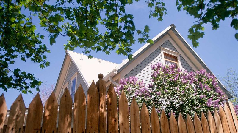 Inspect attached fences for debris and combustible connections